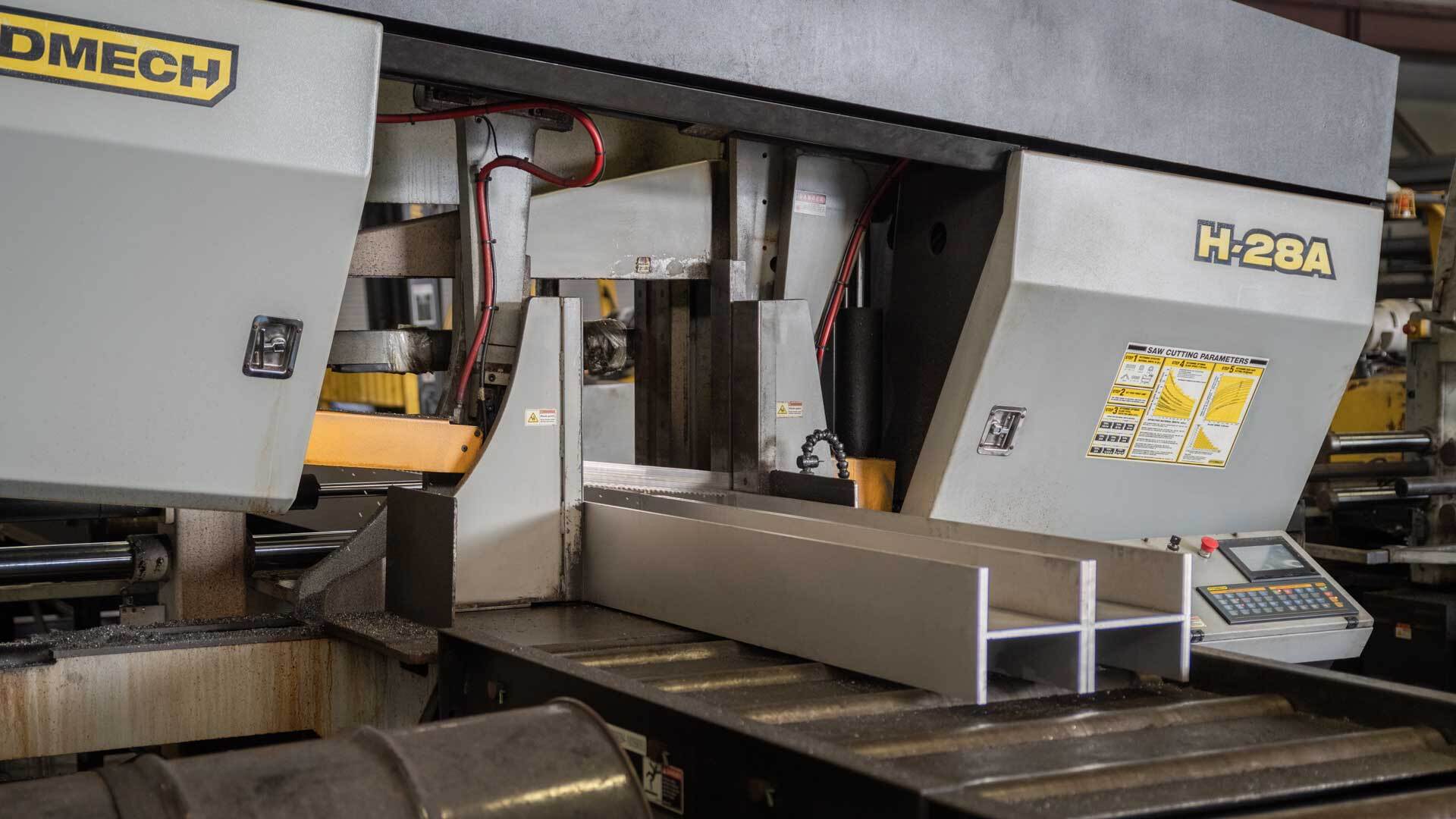 Cutting stainless wide flange beams on our Hydmech band saw.